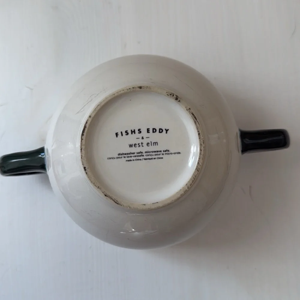 Bowl style mug with two handles. Font reads “a whole latte love”